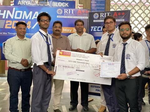 Team receiving the Technomax prize at RIT Roorkee